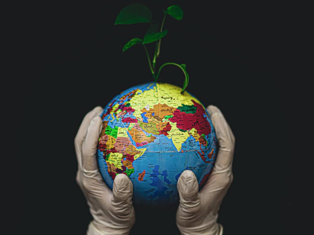 gloved globe - fateme alaie on unsplash