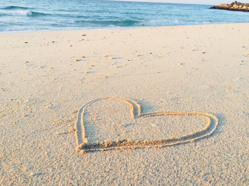 Heart in Sand on beach by Khadeeja Yasser on unsplash