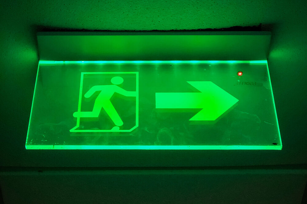 Green exit sign - Isravel Raj on Unsplash YuN8QjfBYUY
