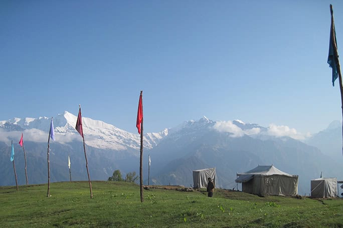 India Village Ways, hiking Himalayas - ARYU tented camp with flags