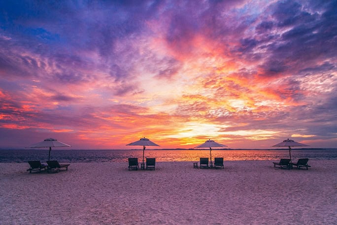 Indonesia-Nikoi-Island-sunset-beach-loungers-684w