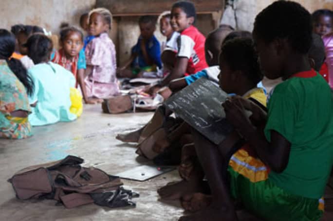 school kids on floor Back to School Appeal, (c) SEED Madagascar
