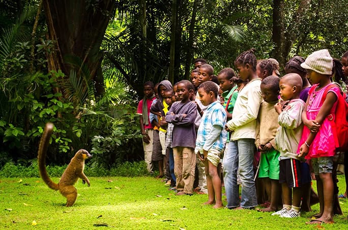 Sustainable Travel: Madagascar community & conservation - lemur & kids - volunteer in conservation
