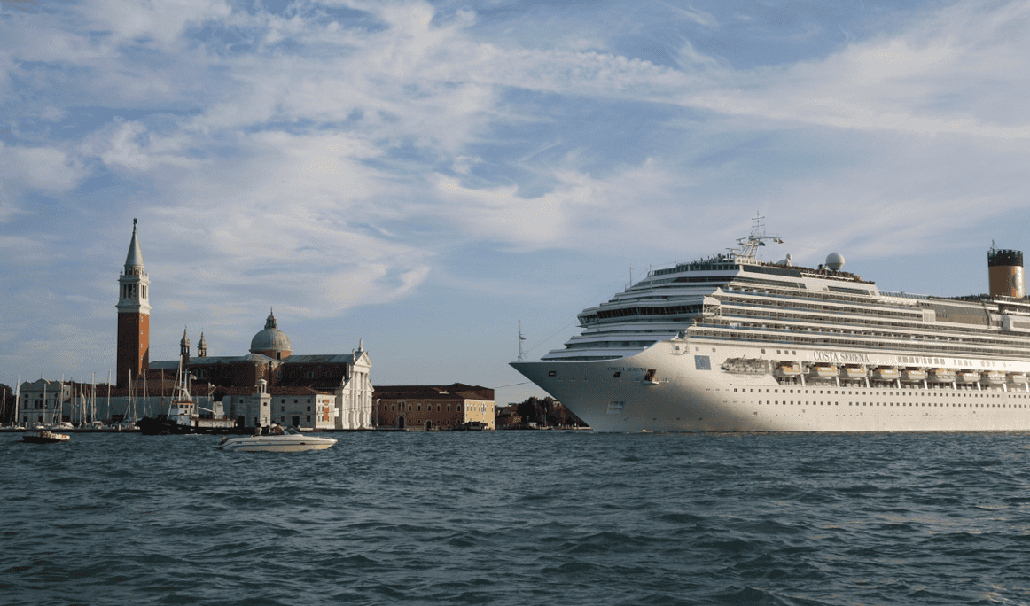 Cruise Ship Costa Serena dwarfs San Giorgio Maggiore Venice sailing in front